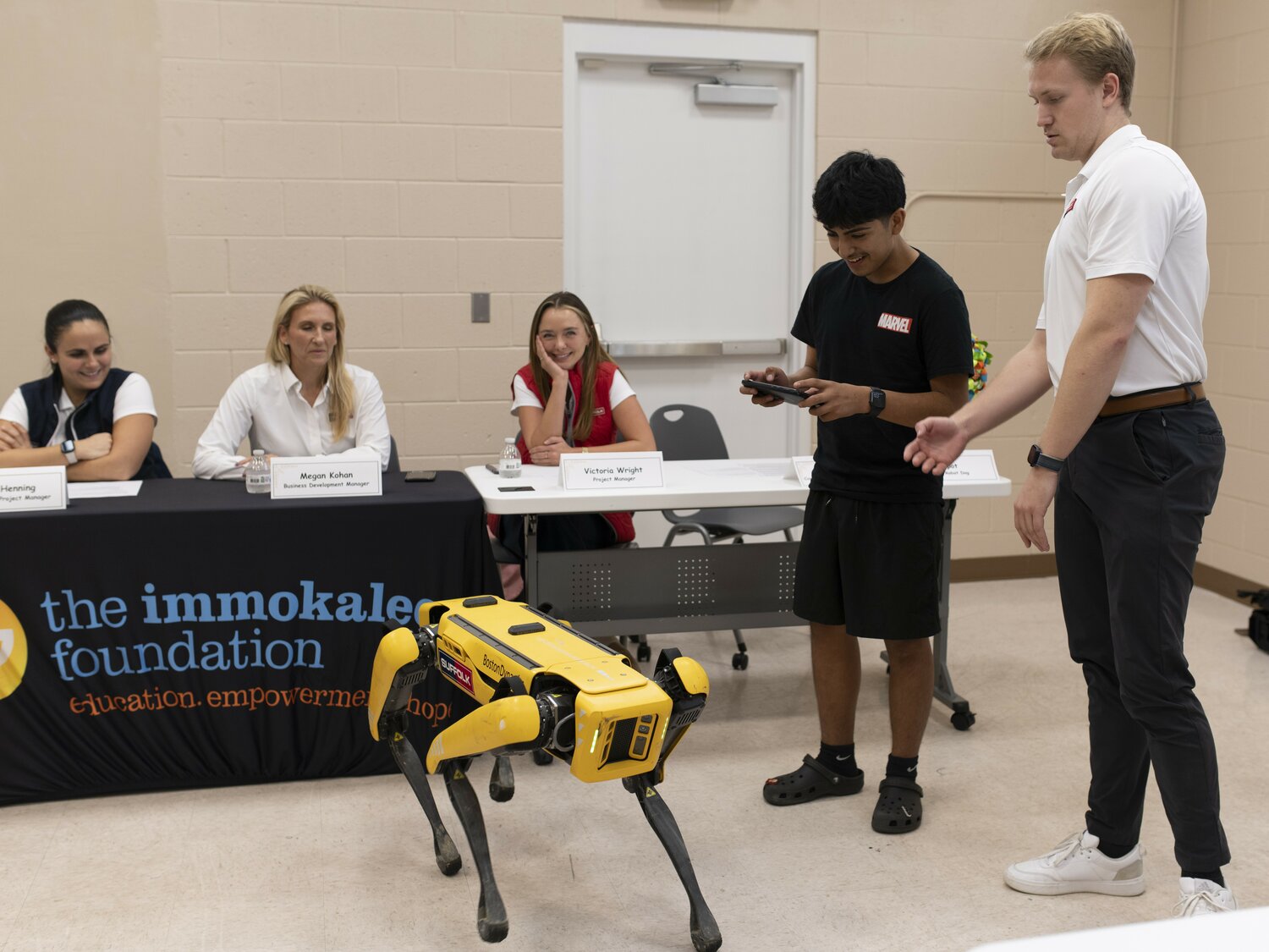 A student experiences the abilities of Spot, the Robot Dog during the “Business, Construction and Engineering Career Pathway” event presented by the Immokalee Foundation on Dec. 7.